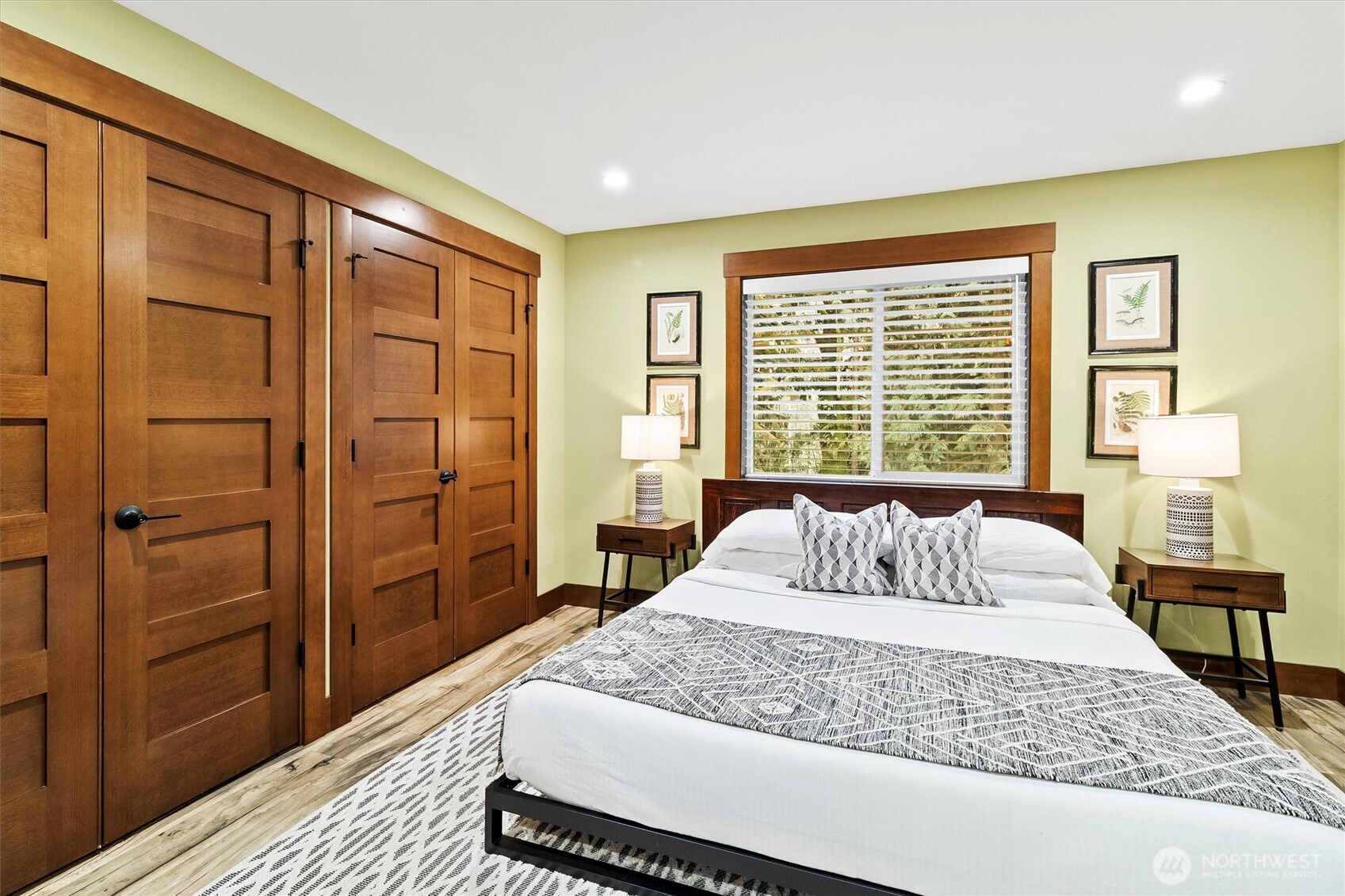 7381 Scott Place Deming, WA 98244 - Photo 20 of 40 a bedroom with a large bed and wooden floor