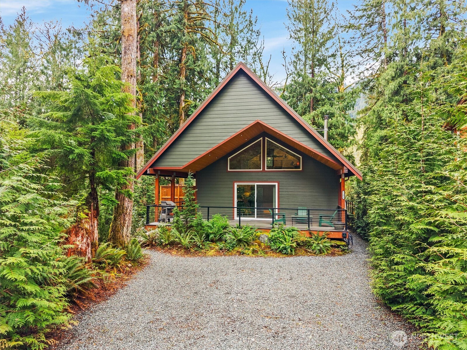7381 Scott Place Deming, WA 98244 - Photo 2 of 40 a front view of a house with a yard and trees