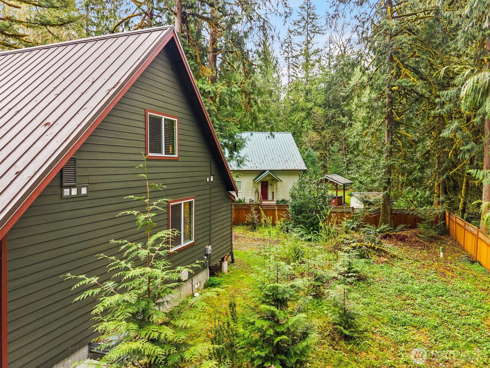7381 Scott Place Deming, WA 98244 - Photo 32 of 40 a backyard of a house with table and chairs