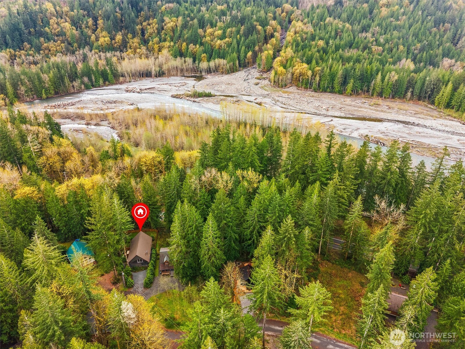 7381 Scott Place Deming, WA 98244 - Photo 38 of 40 a view of a yard with plants and wooden fence