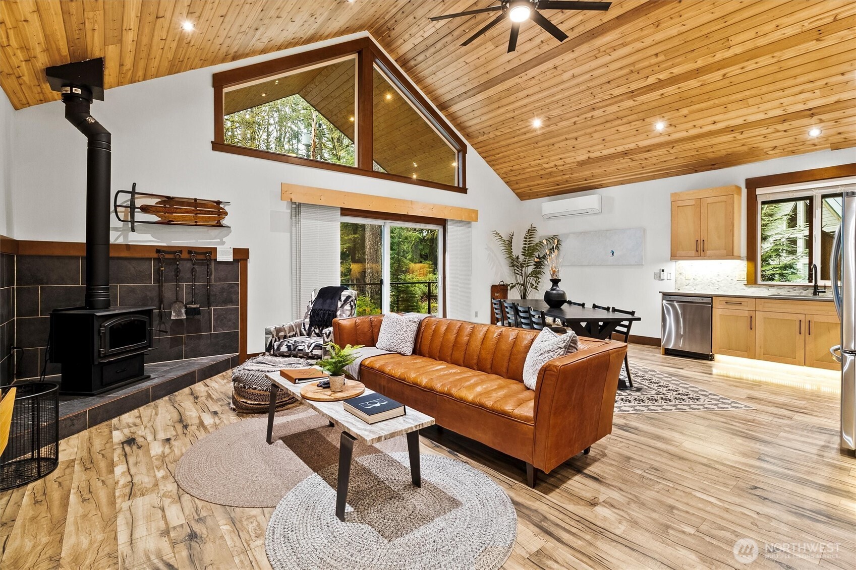 7381 Scott Place Deming, WA 98244 - Photo 4 of 40 a living room with fireplace furniture and a wooden floor