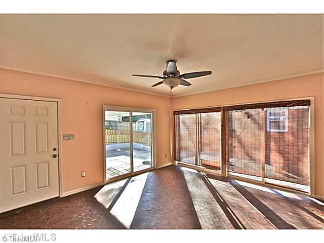 4601 Highberry Road Greensboro, NC 27410 - Photo 14 of 16 Sunroom. Pella sliding doors this three seasons room is a joy opening on to the back patio
