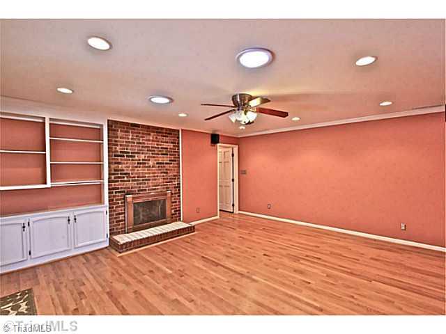 4601 Highberry Road Greensboro, NC 27410 - Photo 7 of 16 Den/Family/Great Room. Large family room open to the kitchen and the sunroom