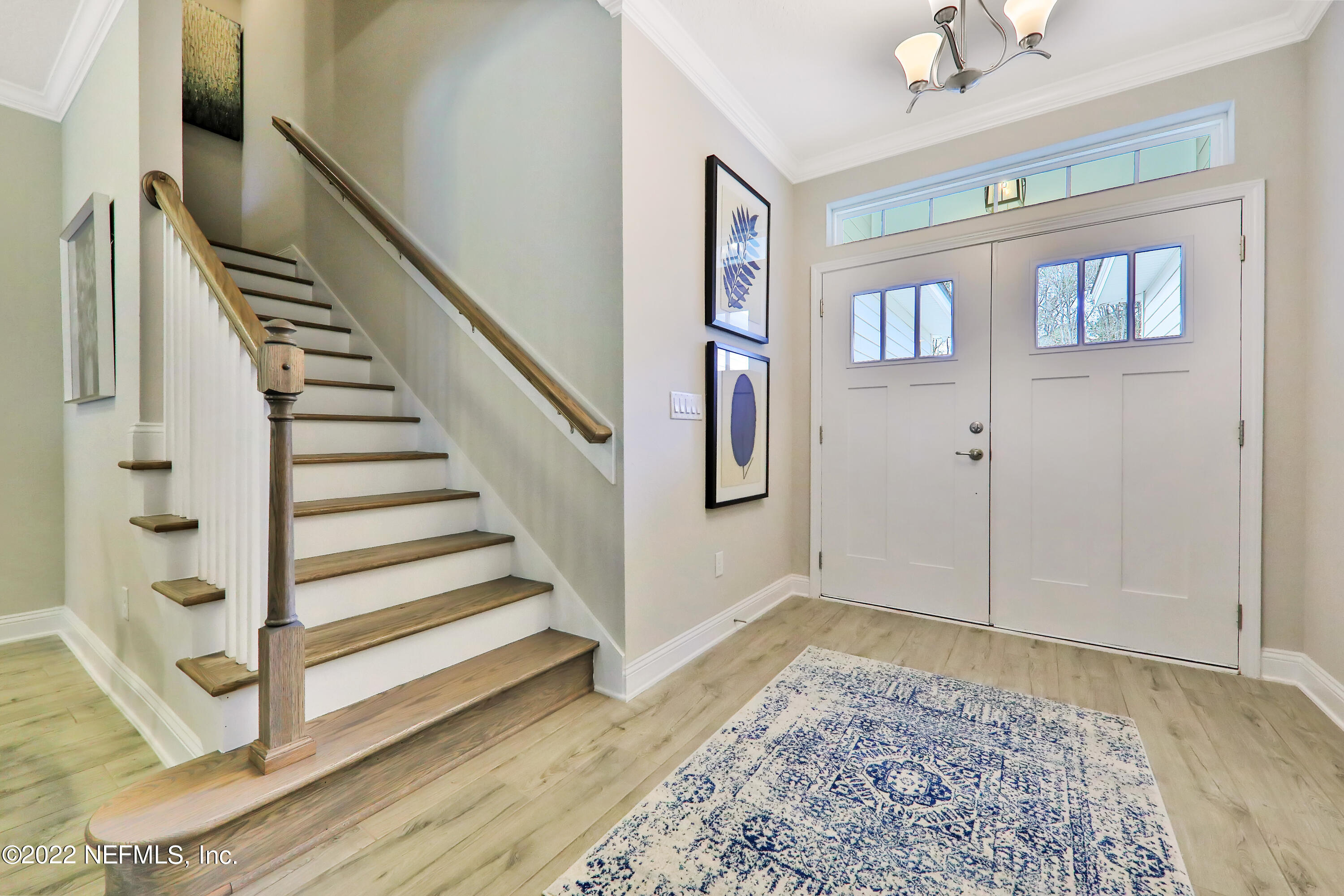 608 Ivory Palm Road Orange Park, FL 32073 - Photo 12 of 33 a view of a livingroom with wooden floor and stairs