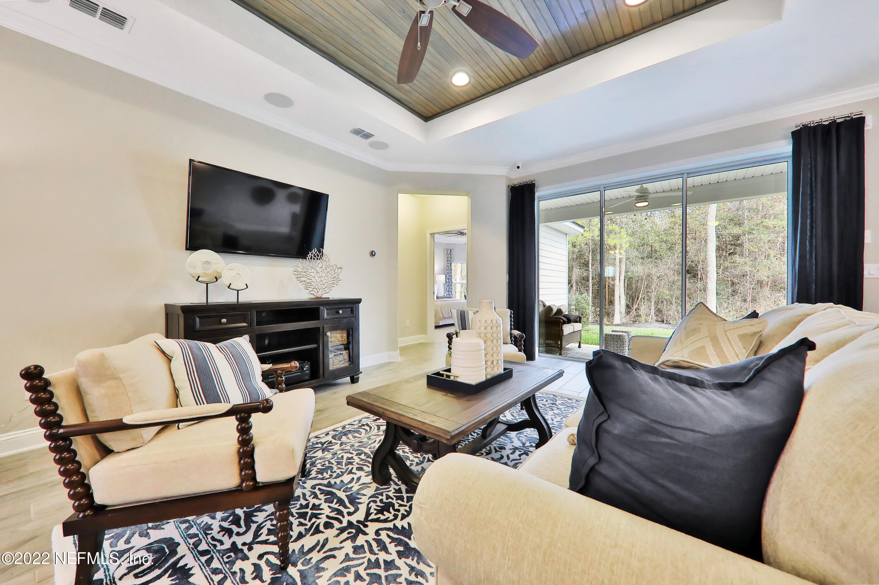 608 Ivory Palm Road Orange Park, FL 32073 - Photo 16 of 33 a living room with furniture and a flat screen tv