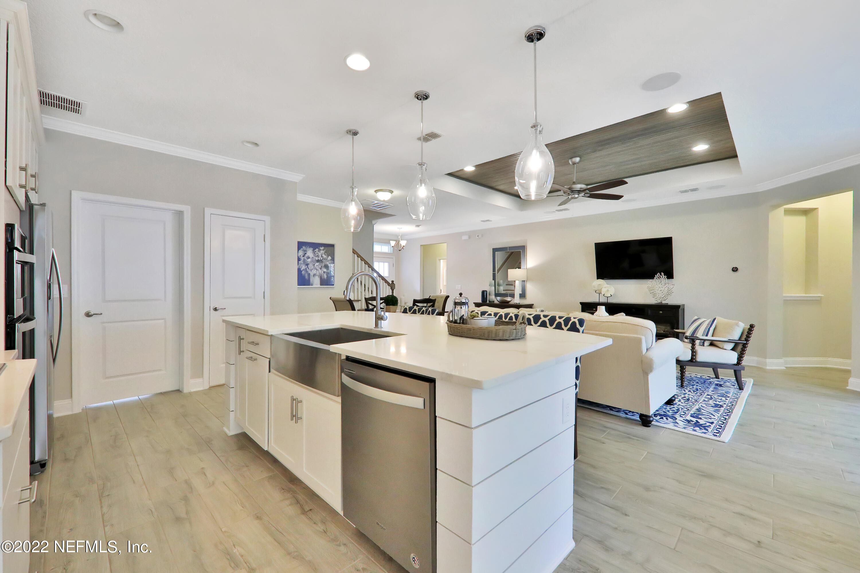 608 Ivory Palm Road Orange Park, FL 32073 - Photo 23 of 33 a kitchen with a sink and a stove top oven with wooden floor