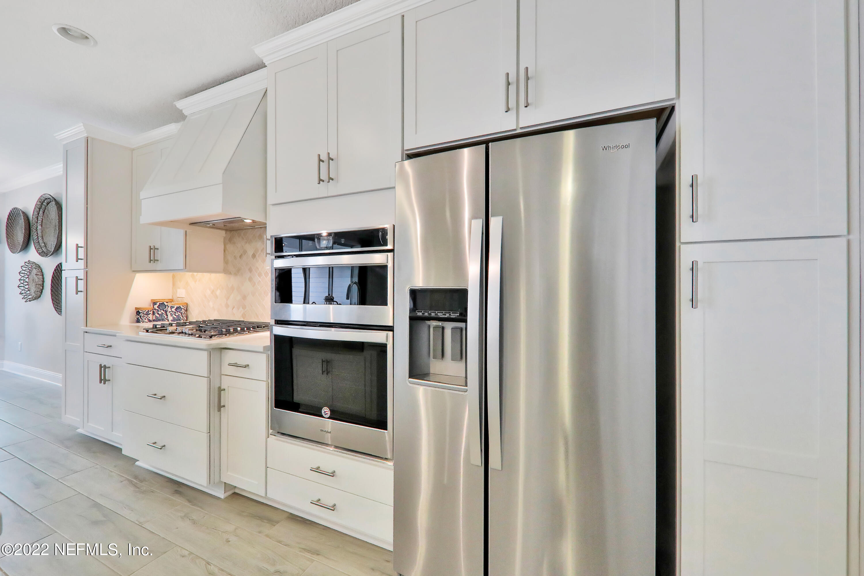 608 Ivory Palm Road Orange Park, FL 32073 - Photo 24 of 33 a kitchen with stainless steel appliances a refrigerator sink and cabinets