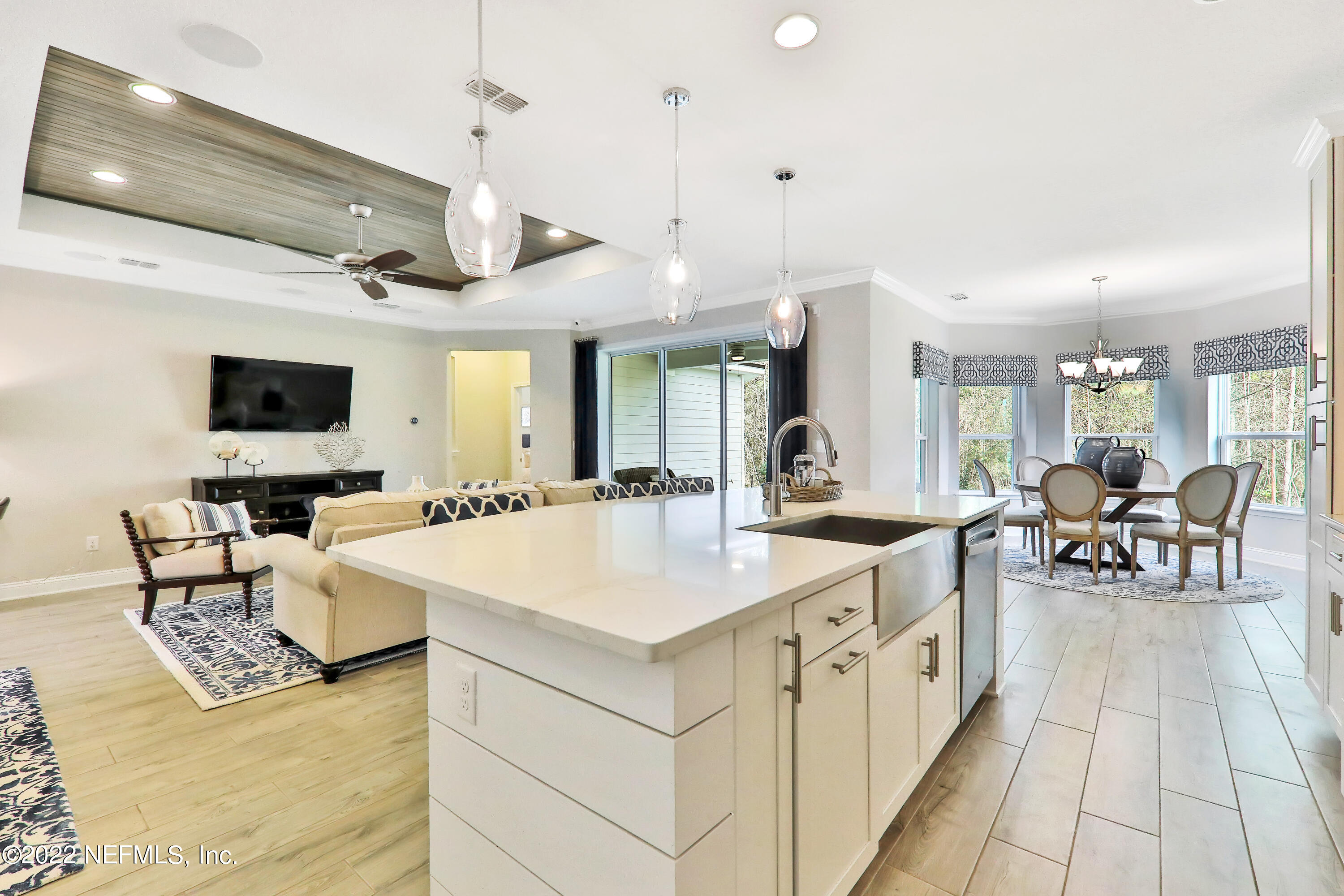608 Ivory Palm Road Orange Park, FL 32073 - Photo 25 of 33 a large kitchen with a table chairs and a floor to ceiling window