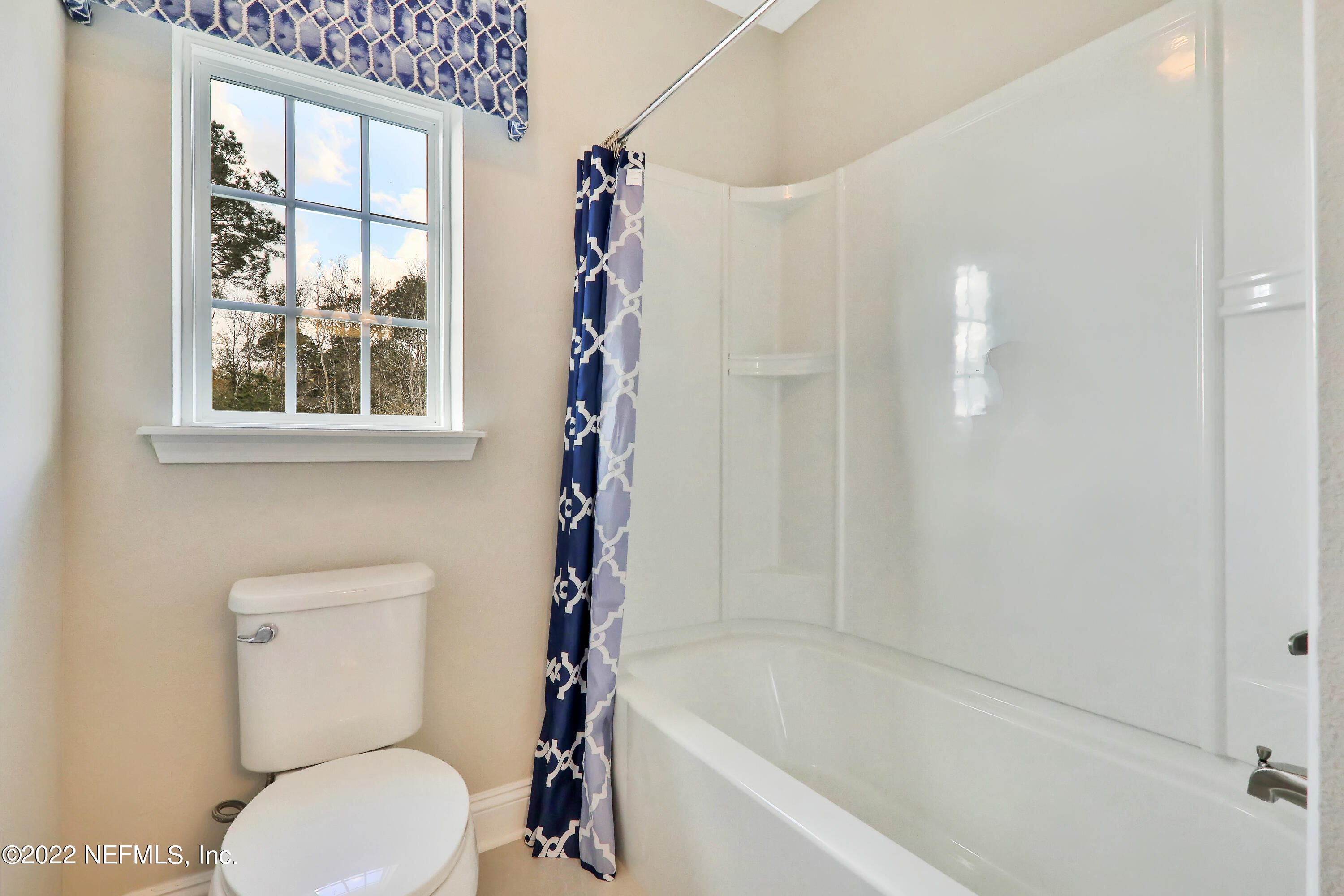 608 Ivory Palm Road Orange Park, FL 32073 - Photo 29 of 33 a white toilet sitting next to a bath tub