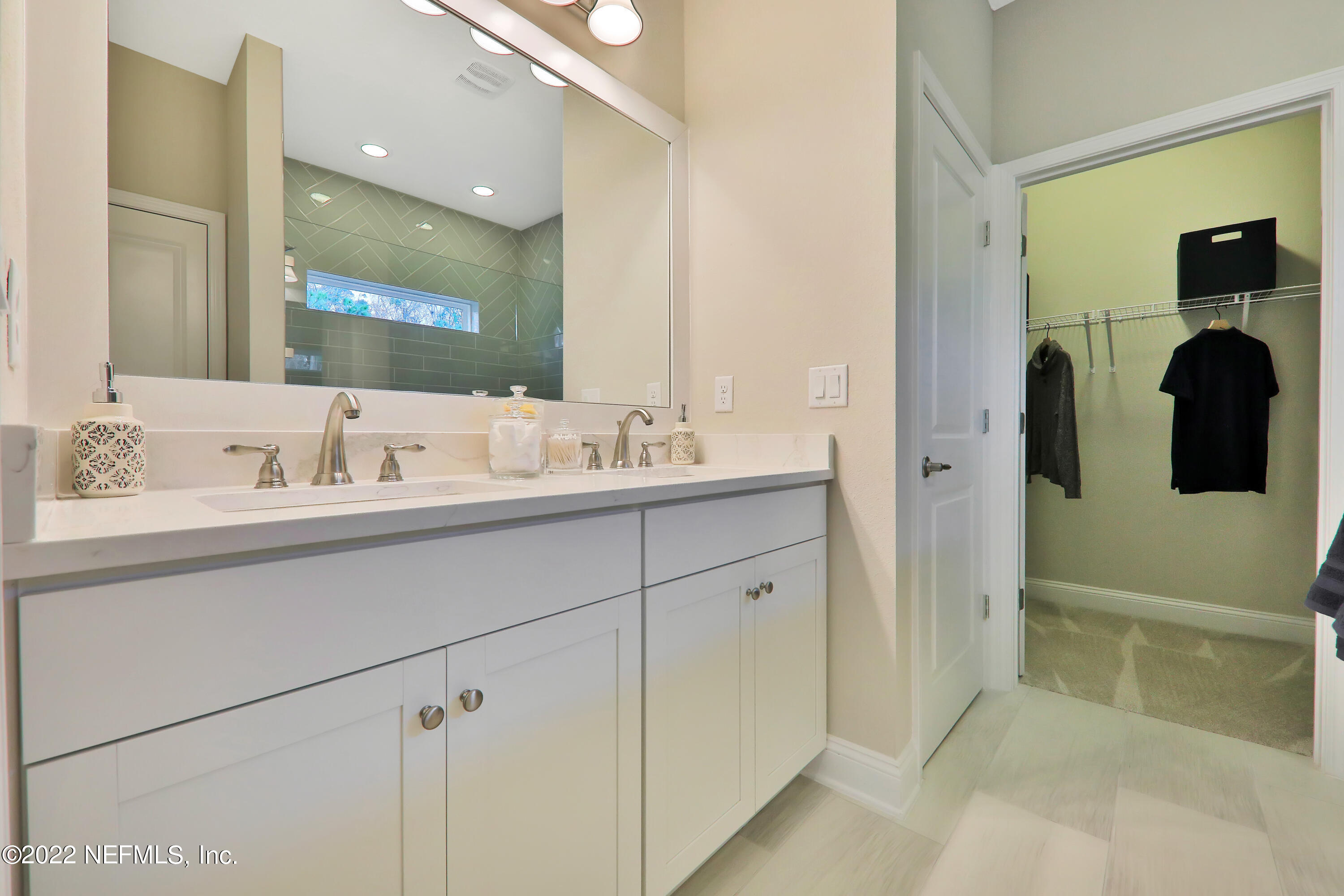 608 Ivory Palm Road Orange Park, FL 32073 - Photo 3 of 33 a bathroom with a sink and a mirror