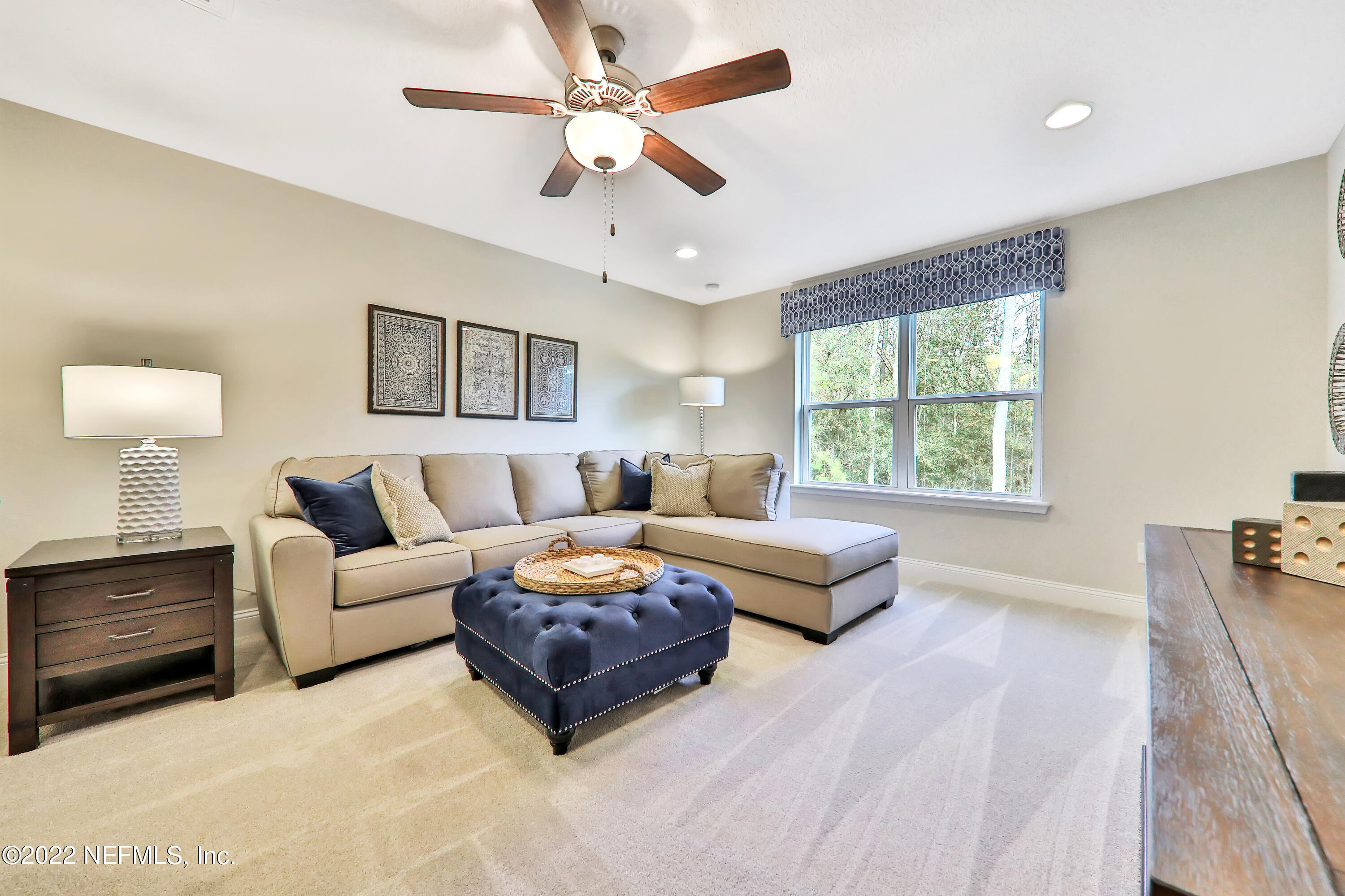 608 Ivory Palm Road Orange Park, FL 32073 - Photo 32 of 33 a living room with furniture and a large window