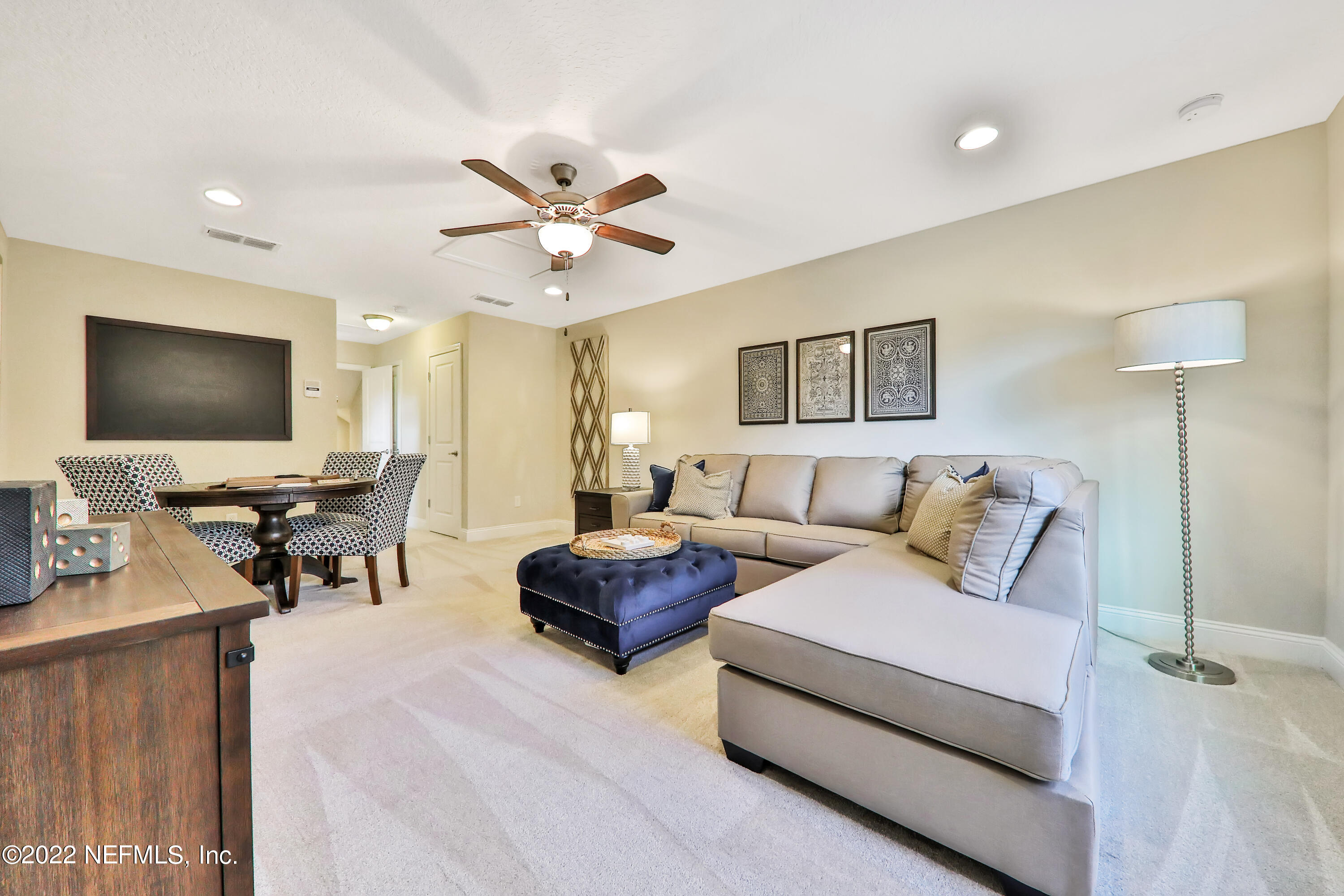 608 Ivory Palm Road Orange Park, FL 32073 - Photo 33 of 33 a living room with furniture and a flat screen tv