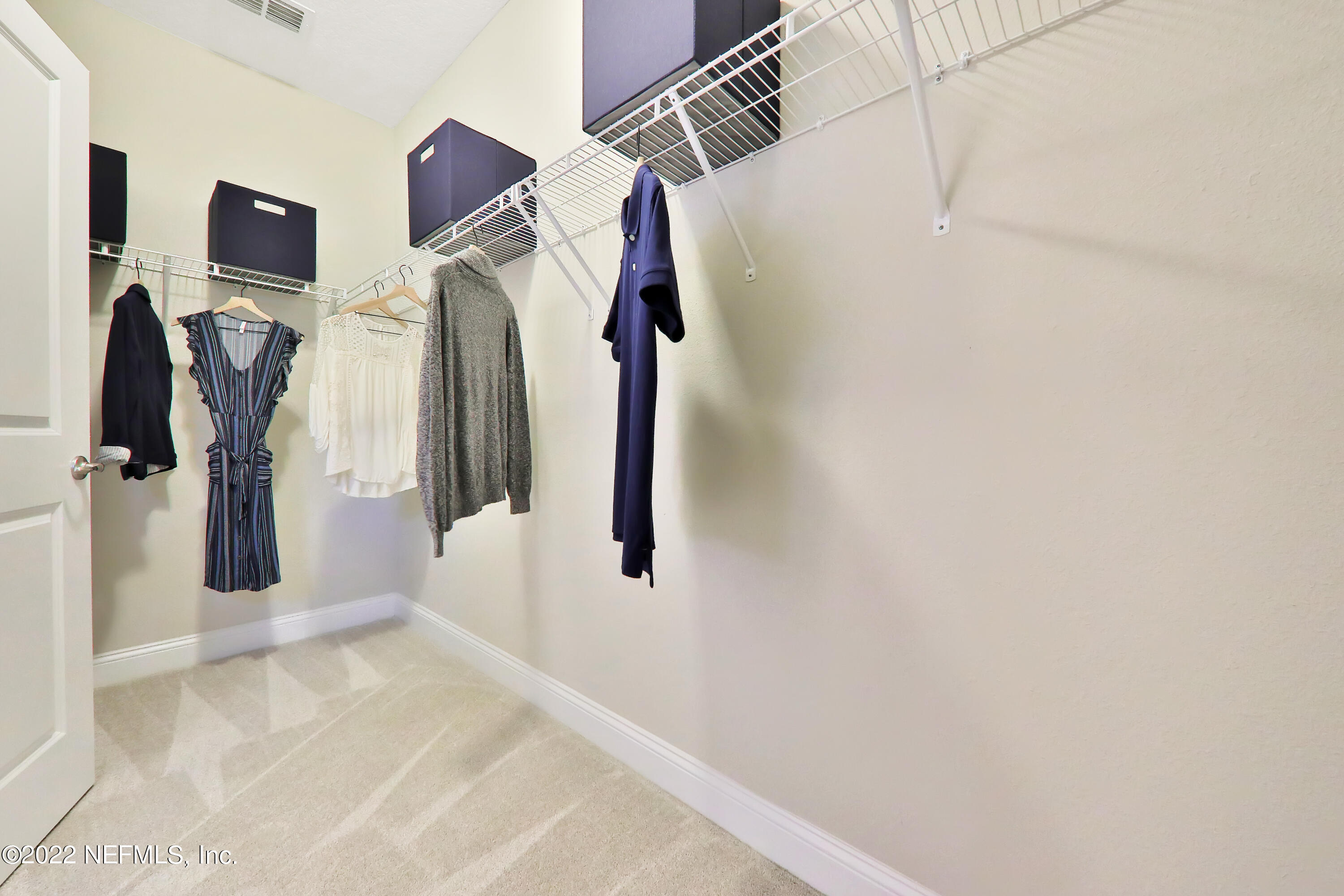 608 Ivory Palm Road Orange Park, FL 32073 - Photo 5 of 33 a view of walk in closet with clothes and shoes