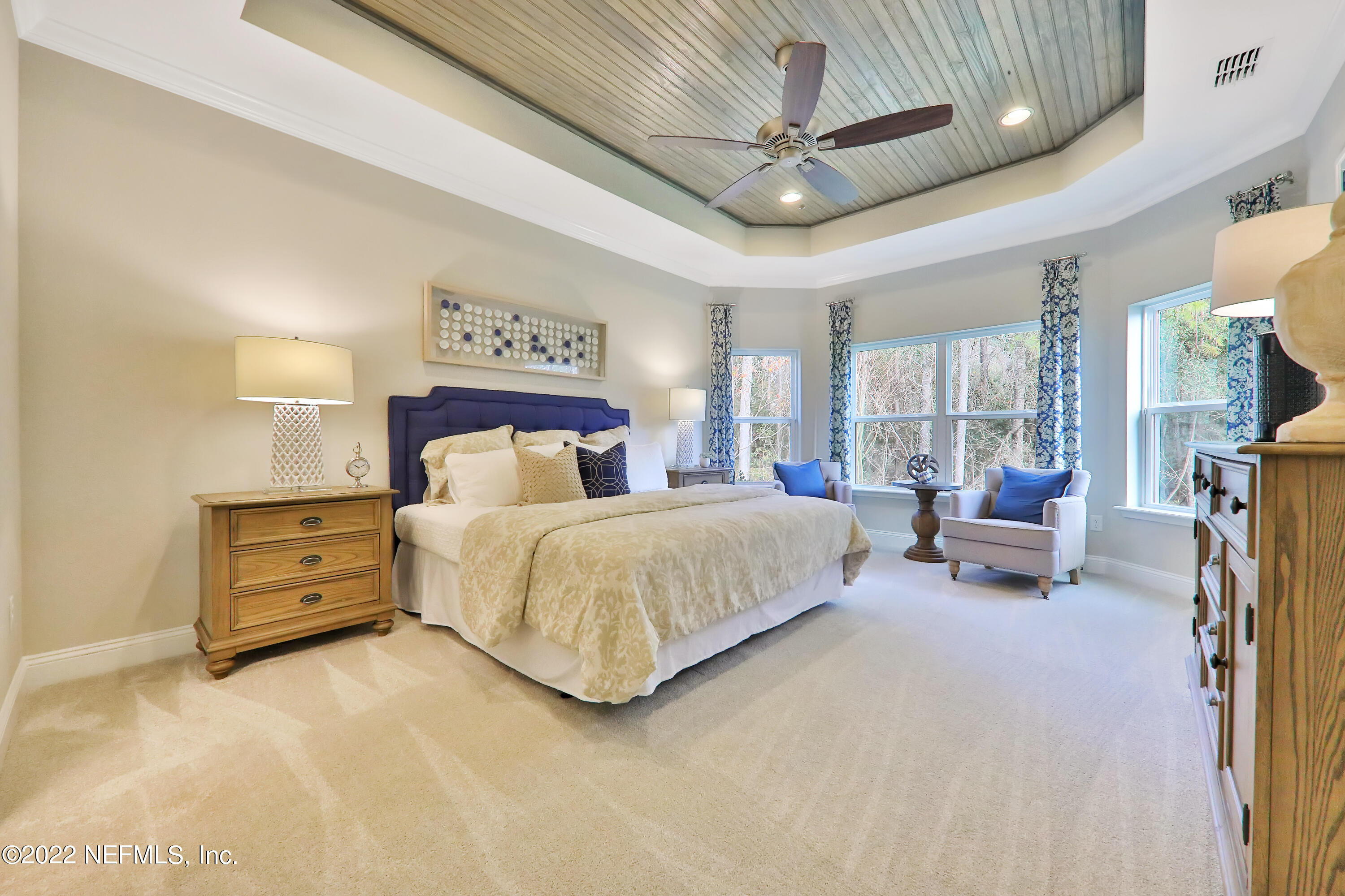 608 Ivory Palm Road Orange Park, FL 32073 - Photo 7 of 33 a spacious bedroom with a bed and ceiling fan