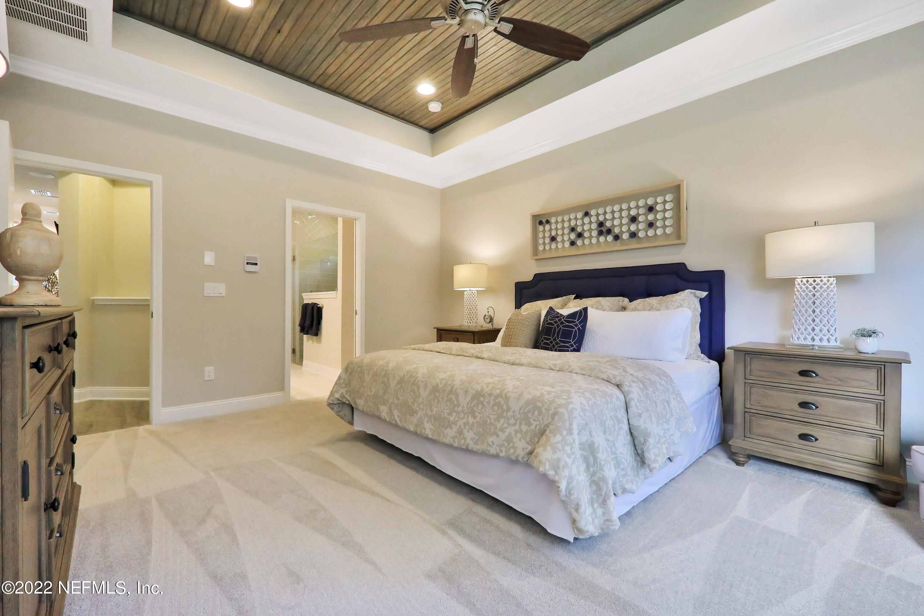 608 Ivory Palm Road Orange Park, FL 32073 - Photo 8 of 33 a bedroom with a bed and a chandelier