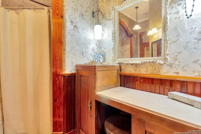 a bathroom with a sink and a mirror