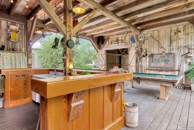 a kitchen with stainless steel appliances granite countertop a stove a sink and a wooden floors