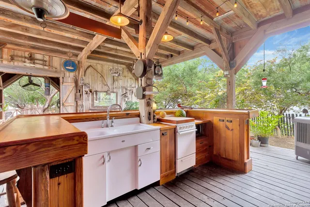 a backyard of a house with table and chairs