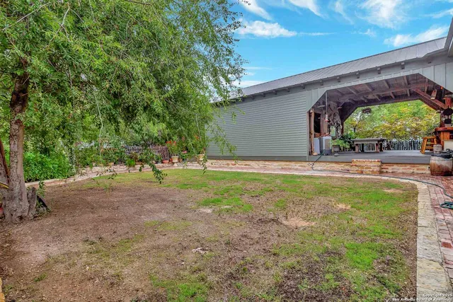 a view of a backyard with a patio