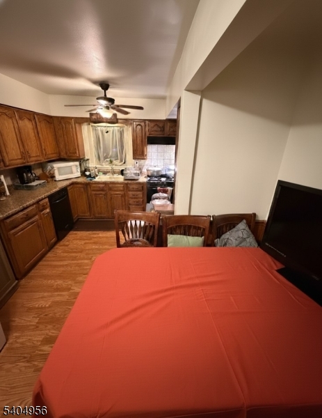628 Second Avenue Lyndhurst, NJ 07071 - Photo 2 of 7 a kitchen with a sink cabinets and appliances