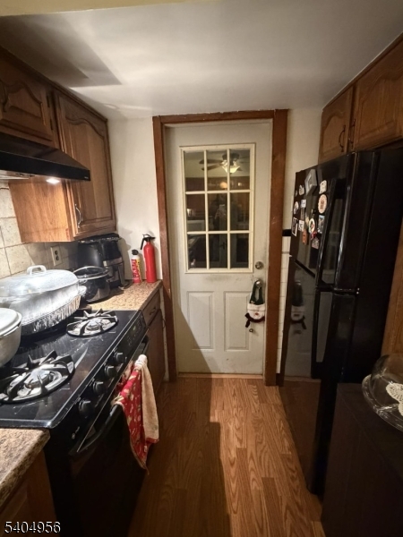 628 Second Avenue Lyndhurst, NJ 07071 - Photo 5 of 7 a kitchen with a sink stove and refrigerator