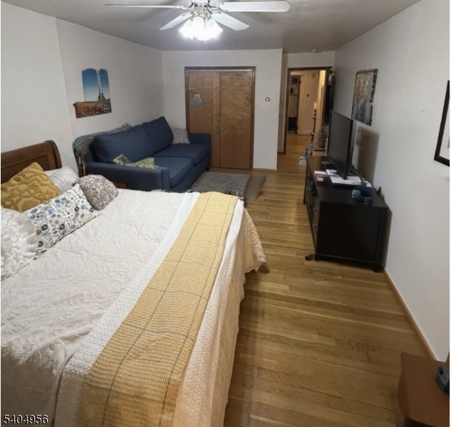 628 Second Avenue Lyndhurst, NJ 07071 - Photo 7 of 7 a bedroom with a bed and wooden floor