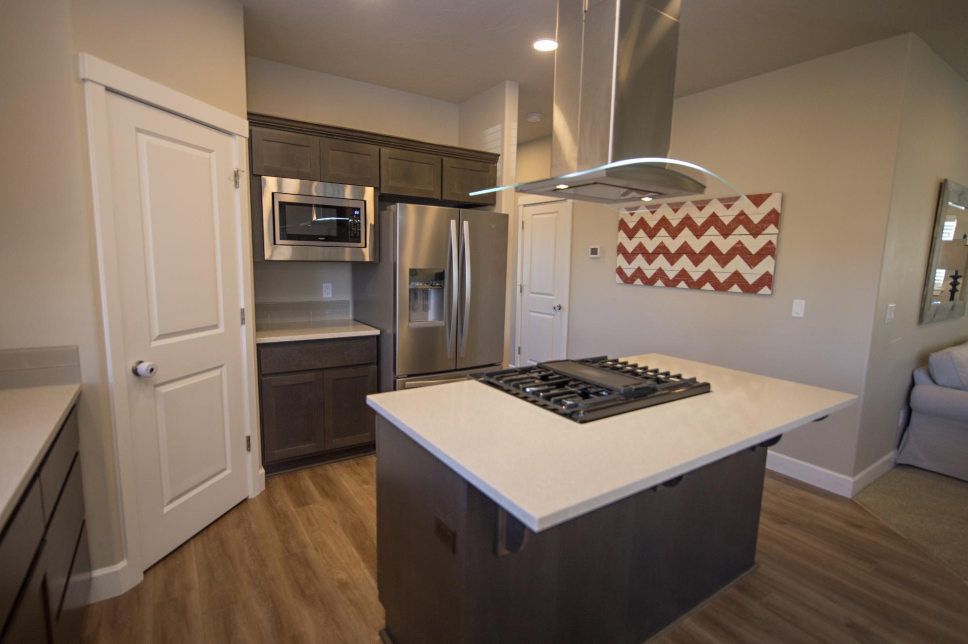 1315 Southwest 23rd Street Redmond, OR 97756 - Photo 7 of 20 Kitchen with Stainless appliances and quartz counters