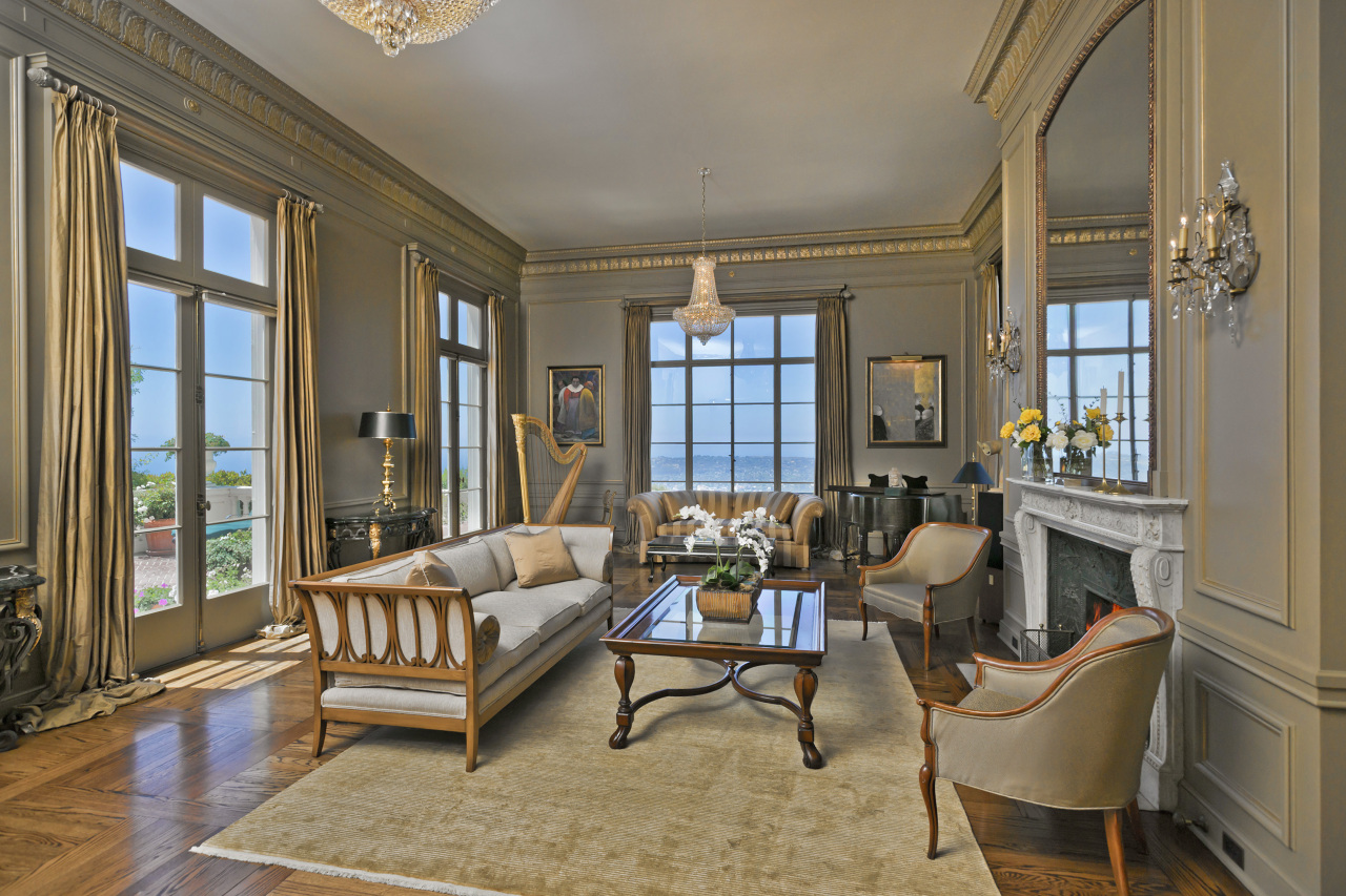931 Las Alturas Road Santa Barbara, CA 93103 - Photo 4 of 9 a living room with furniture and a floor to ceiling window