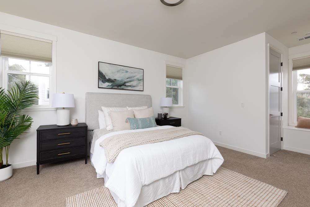 103 Staggi Lane Soquel, CA 95073 - Photo 17 of 35 a bedroom with a bed and a potted plant