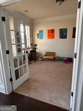 a bathroom with a toilet and a shower curtain