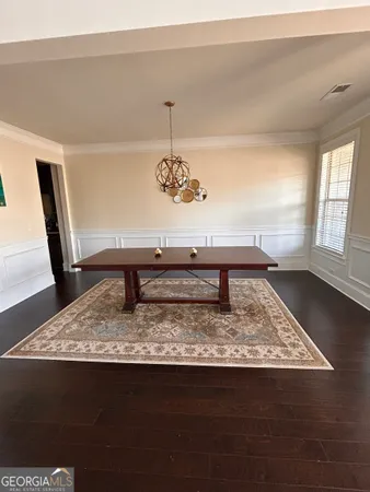 a view of a living room and dining room