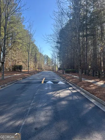a view of a livingroom with furniture and a ceiling fan