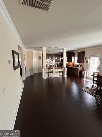 a view of a living room and dining room