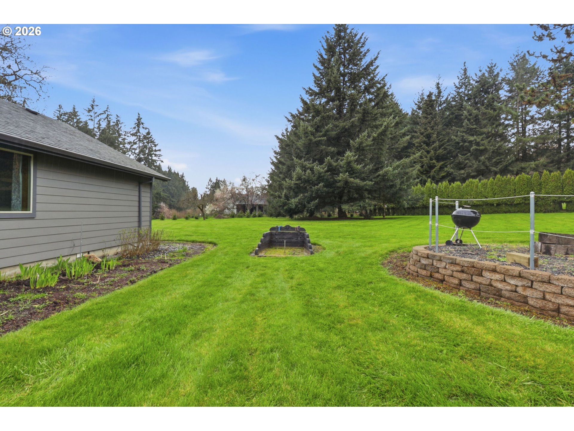 33954 Vista Lane Warren, OR 97053 - Photo 13 of 48 a green field with lots of trees in the background