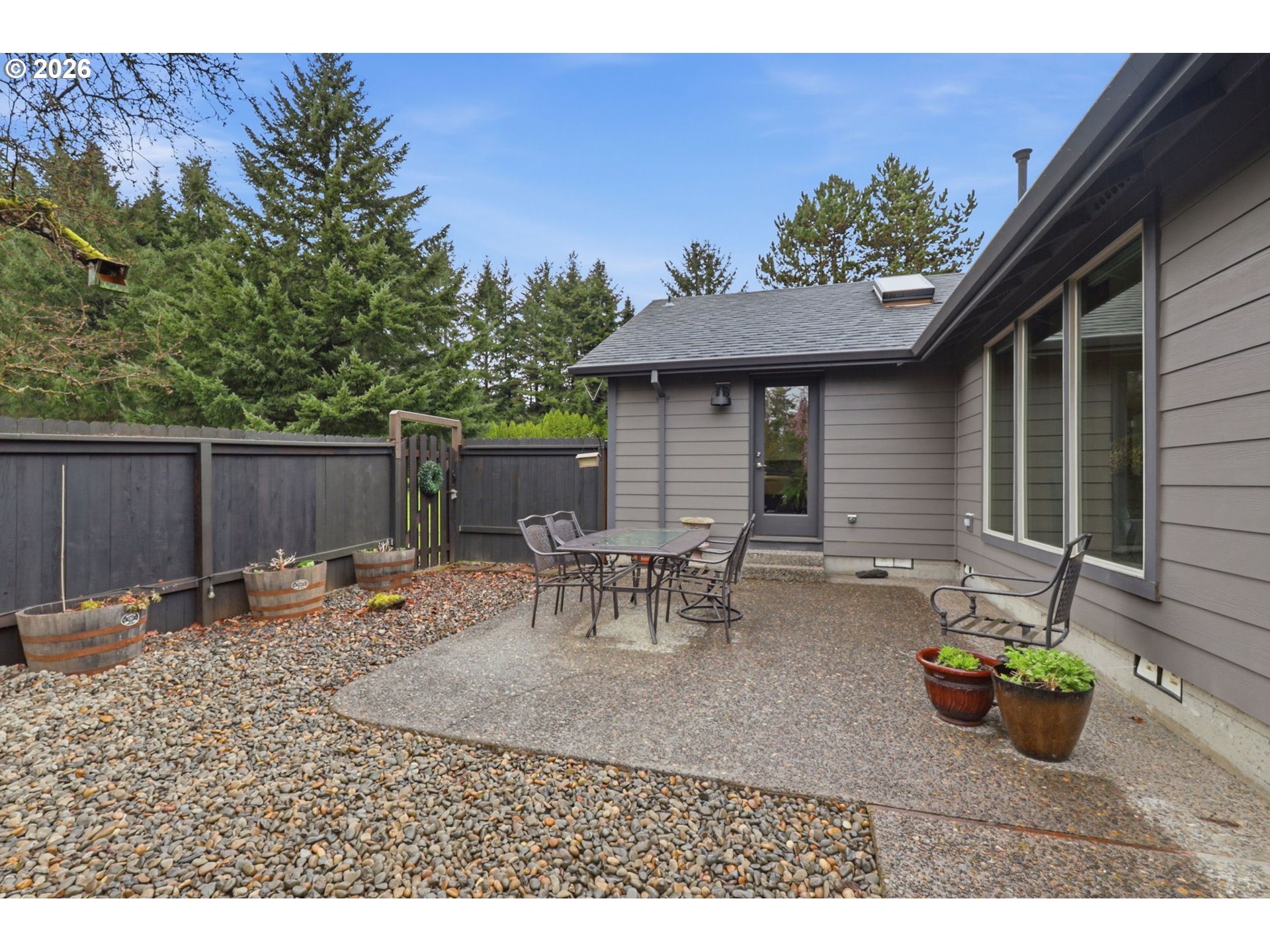 33954 Vista Lane Warren, OR 97053 - Photo 18 of 48 a backyard of a house with table and chairs