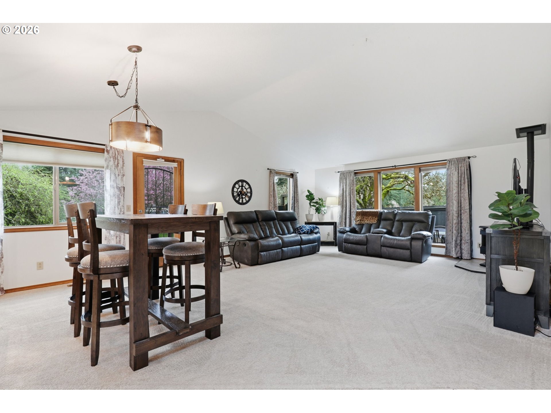 33954 Vista Lane Warren, OR 97053 - Photo 22 of 48 a living room with furniture a window and a chandelier