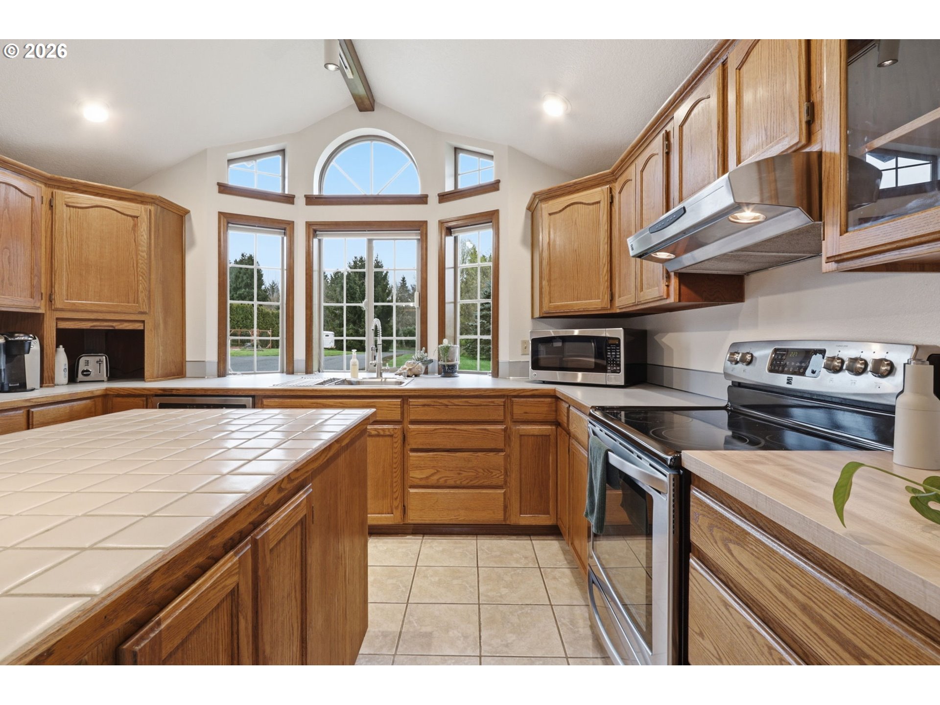 33954 Vista Lane Warren, OR 97053 - Photo 28 of 48 a kitchen with stainless steel appliances granite countertop a stove and a sink