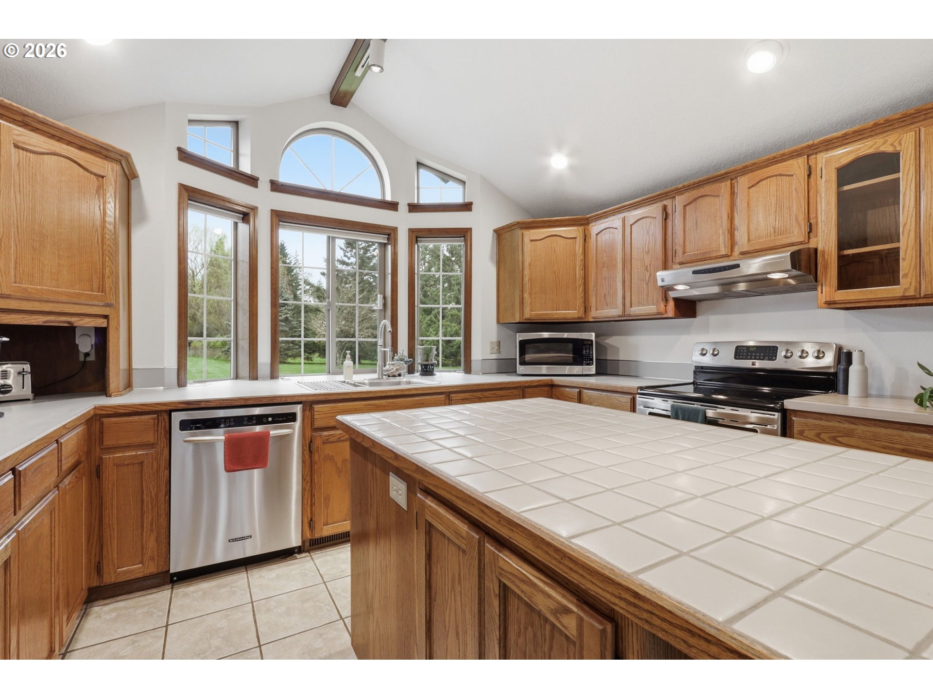 33954 Vista Lane Warren, OR 97053 - Photo 29 of 48 a kitchen with stainless steel appliances granite countertop a stove a sink and a microwave