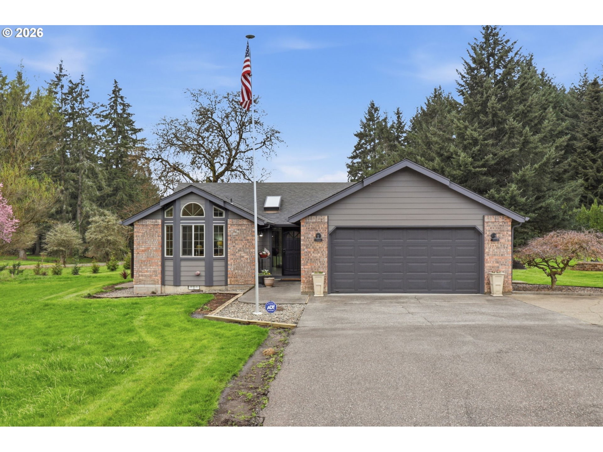 33954 Vista Lane Warren, OR 97053 - Photo 3 of 48 a front view of a house with a yard and garage