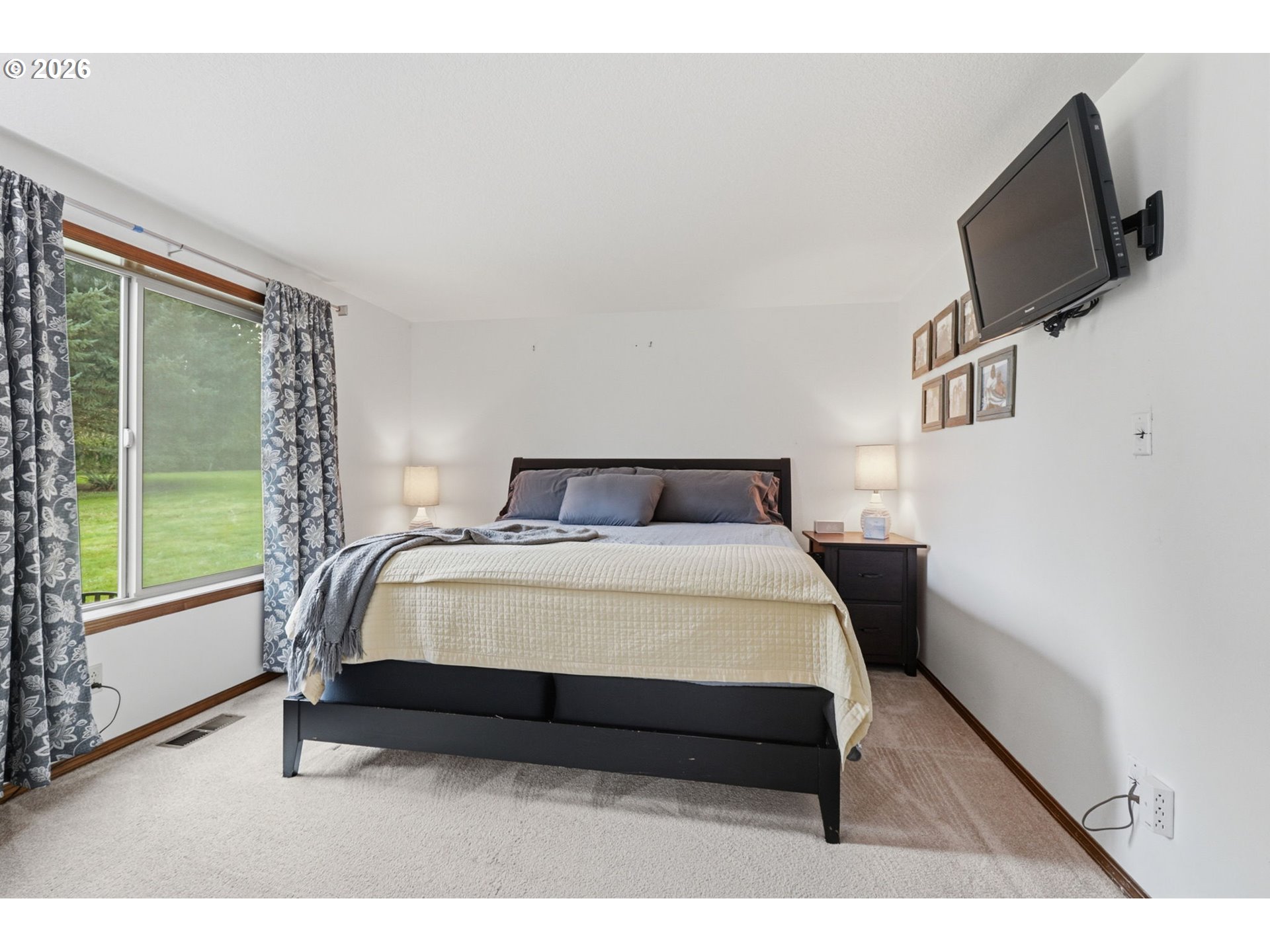 33954 Vista Lane Warren, OR 97053 - Photo 31 of 48 a bed sitting in a bedroom next to a window