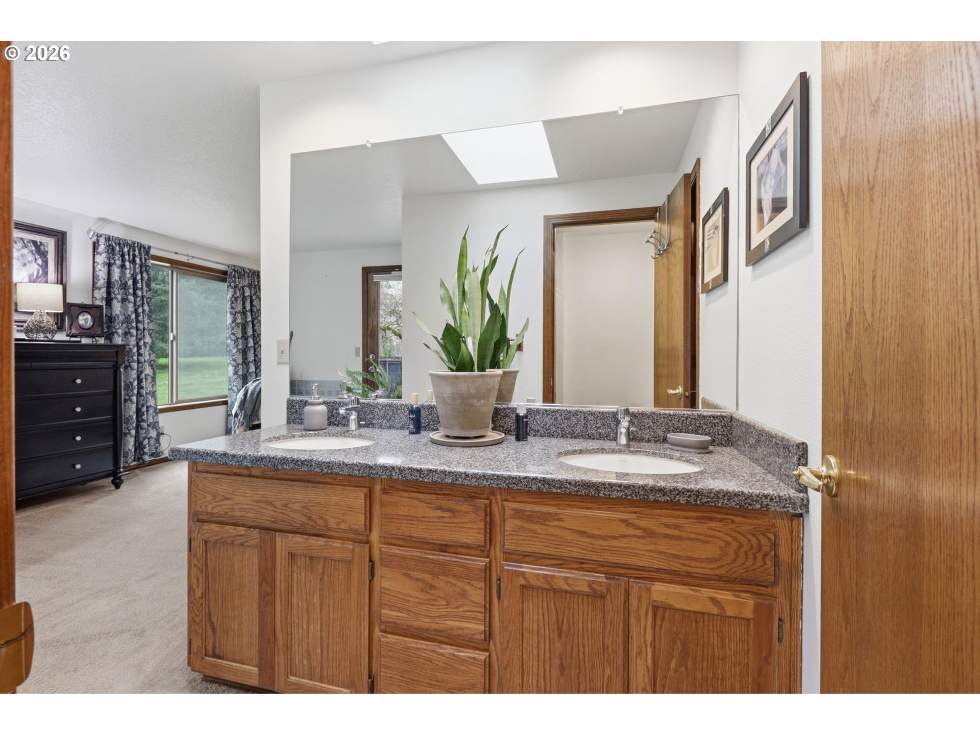 33954 Vista Lane Warren, OR 97053 - Photo 36 of 48 a bathroom with a granite countertop sink and a mirror