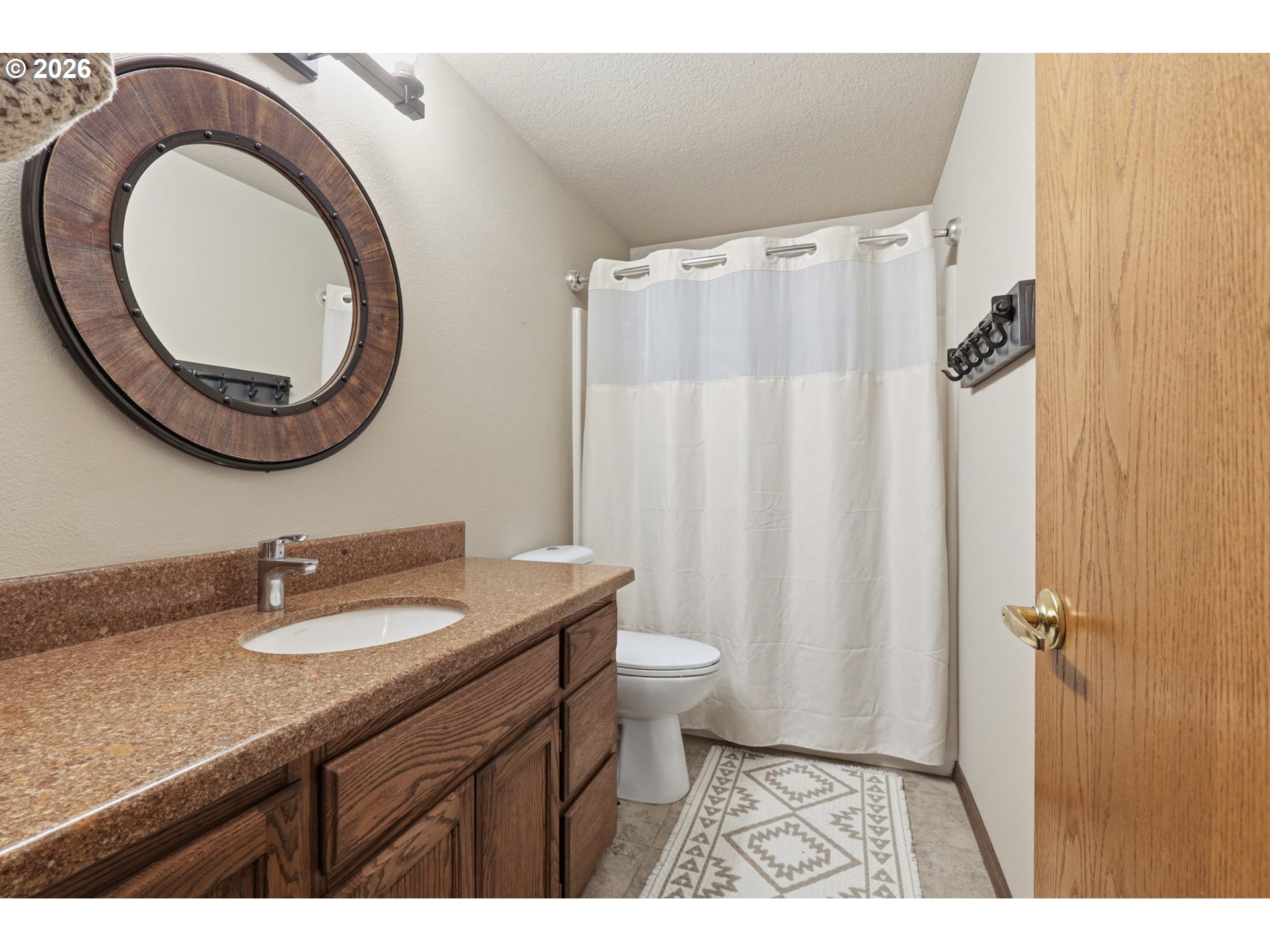 33954 Vista Lane Warren, OR 97053 - Photo 39 of 48 a bathroom with a granite countertop sink toilet and a mirror
