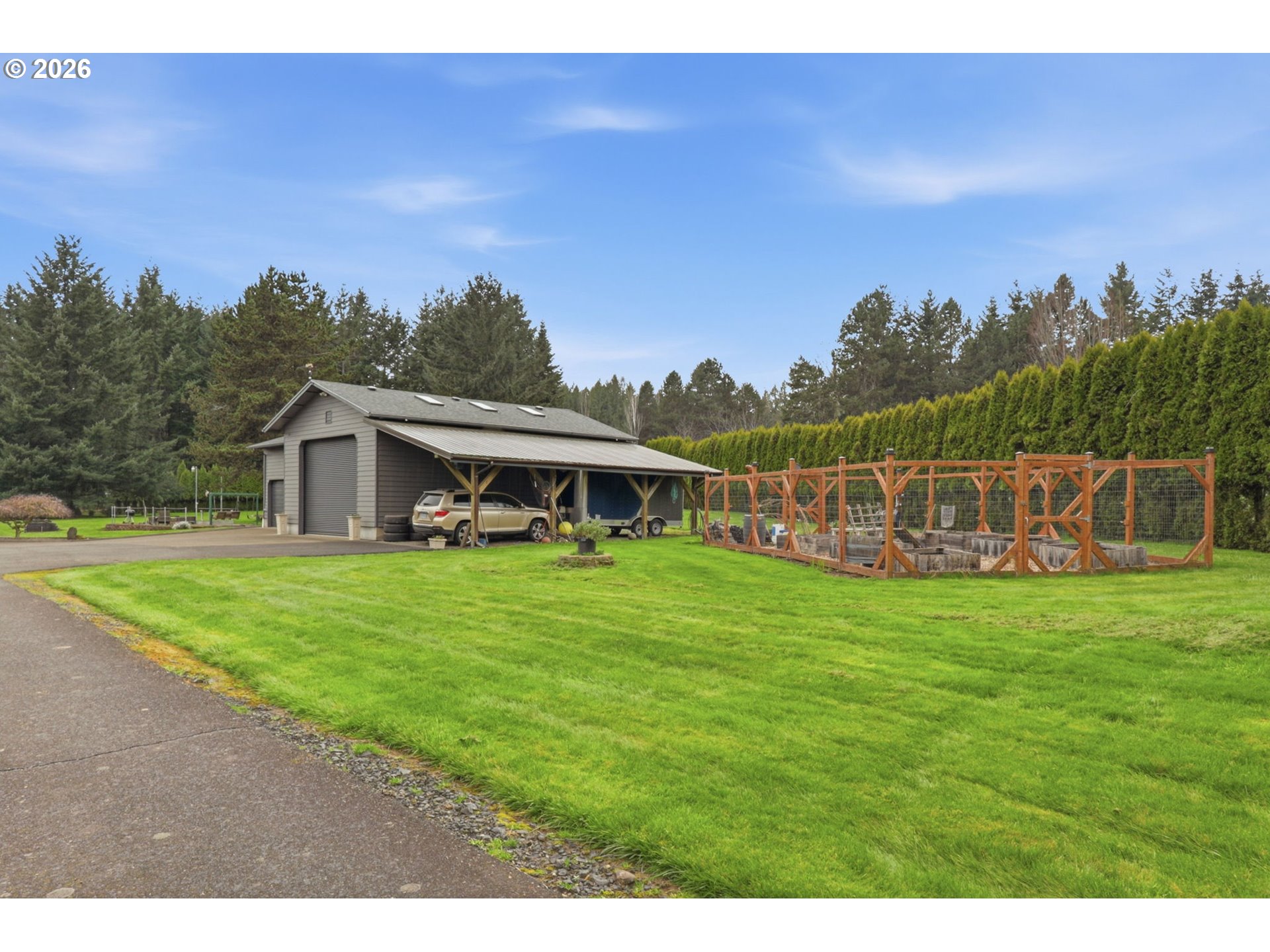 33954 Vista Lane Warren, OR 97053 - Photo 8 of 48 a front view of a house with a garden