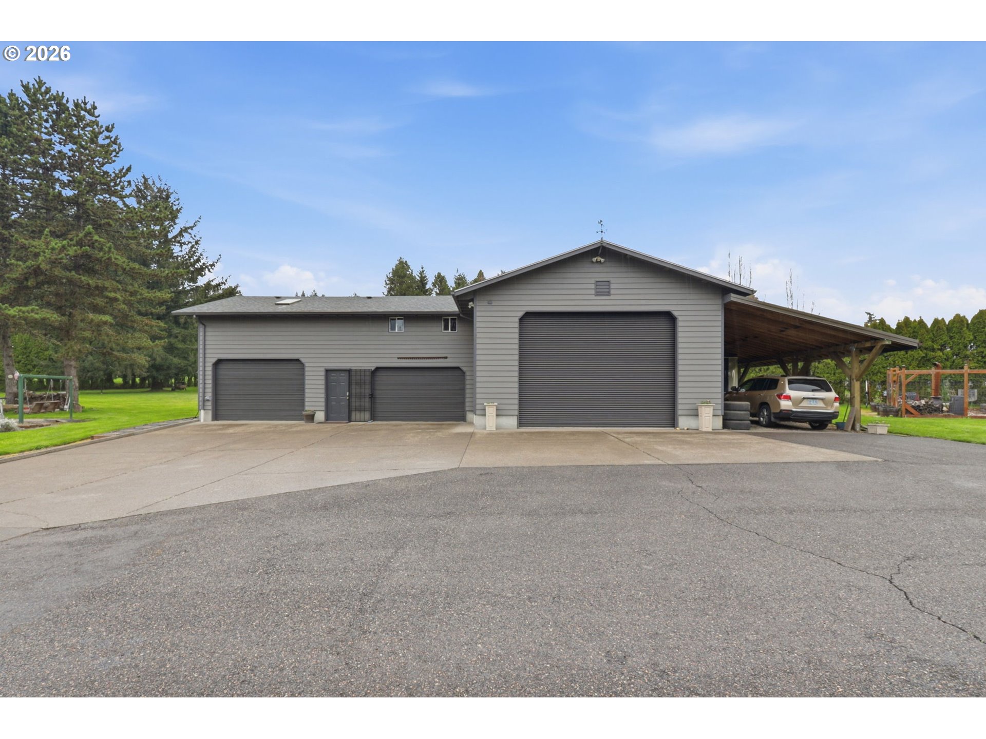 33954 Vista Lane Warren, OR 97053 - Photo 9 of 48 a front view of a house with a yard and garage