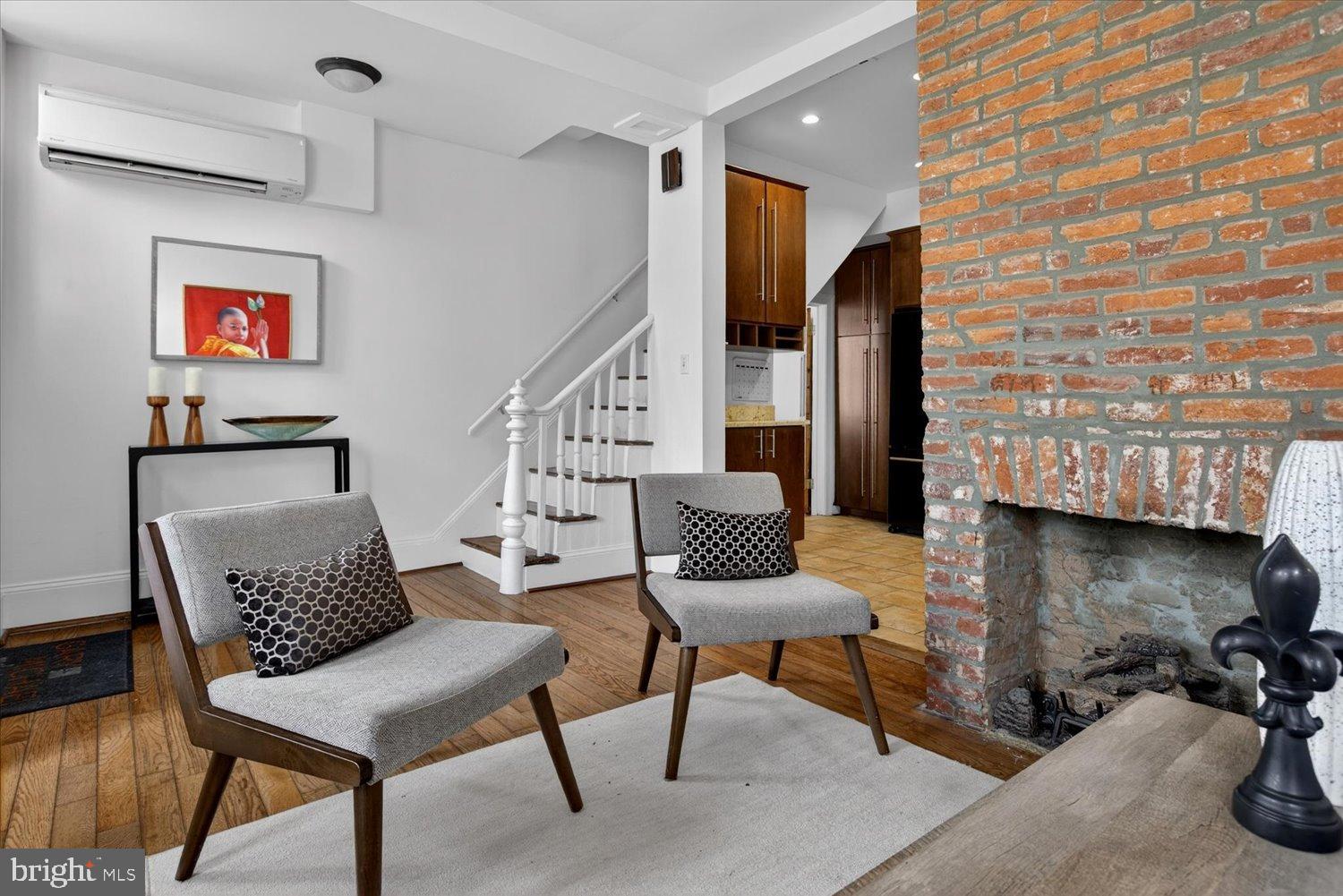 911 Independence Avenue Southeast Washington, DC 20003 - Photo 12 of 38 Charming living space with rustic brick accents.