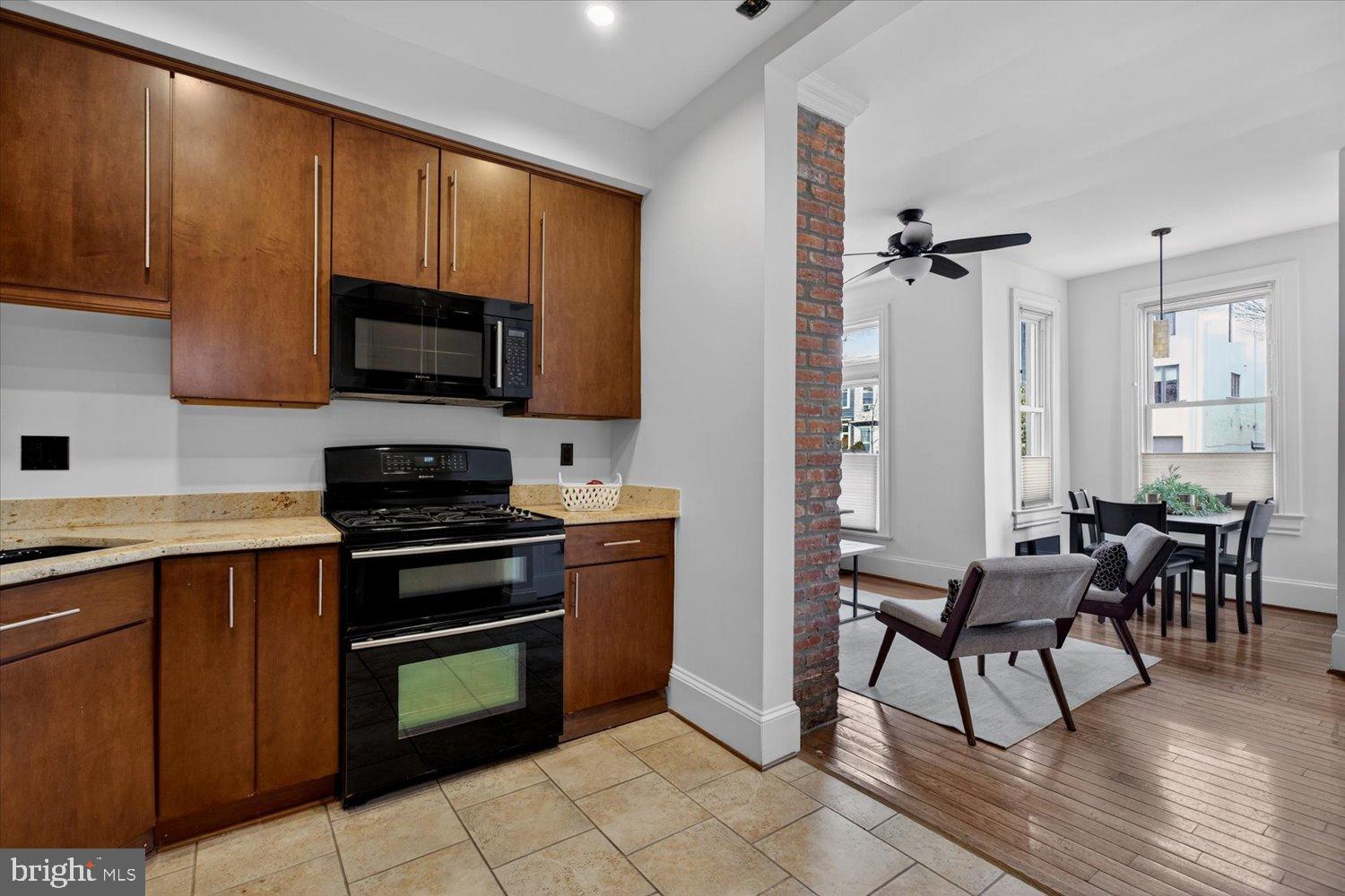 911 Independence Avenue Southeast Washington, DC 20003 - Photo 17 of 38 Modern kitchen with warm wood accents.
