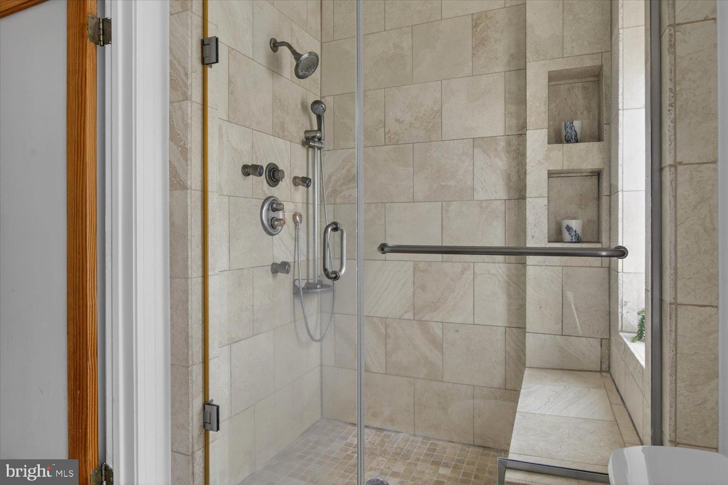 911 Independence Avenue Southeast Washington, DC 20003 - Photo 30 of 38 Elegant tiled shower with modern fixtures.