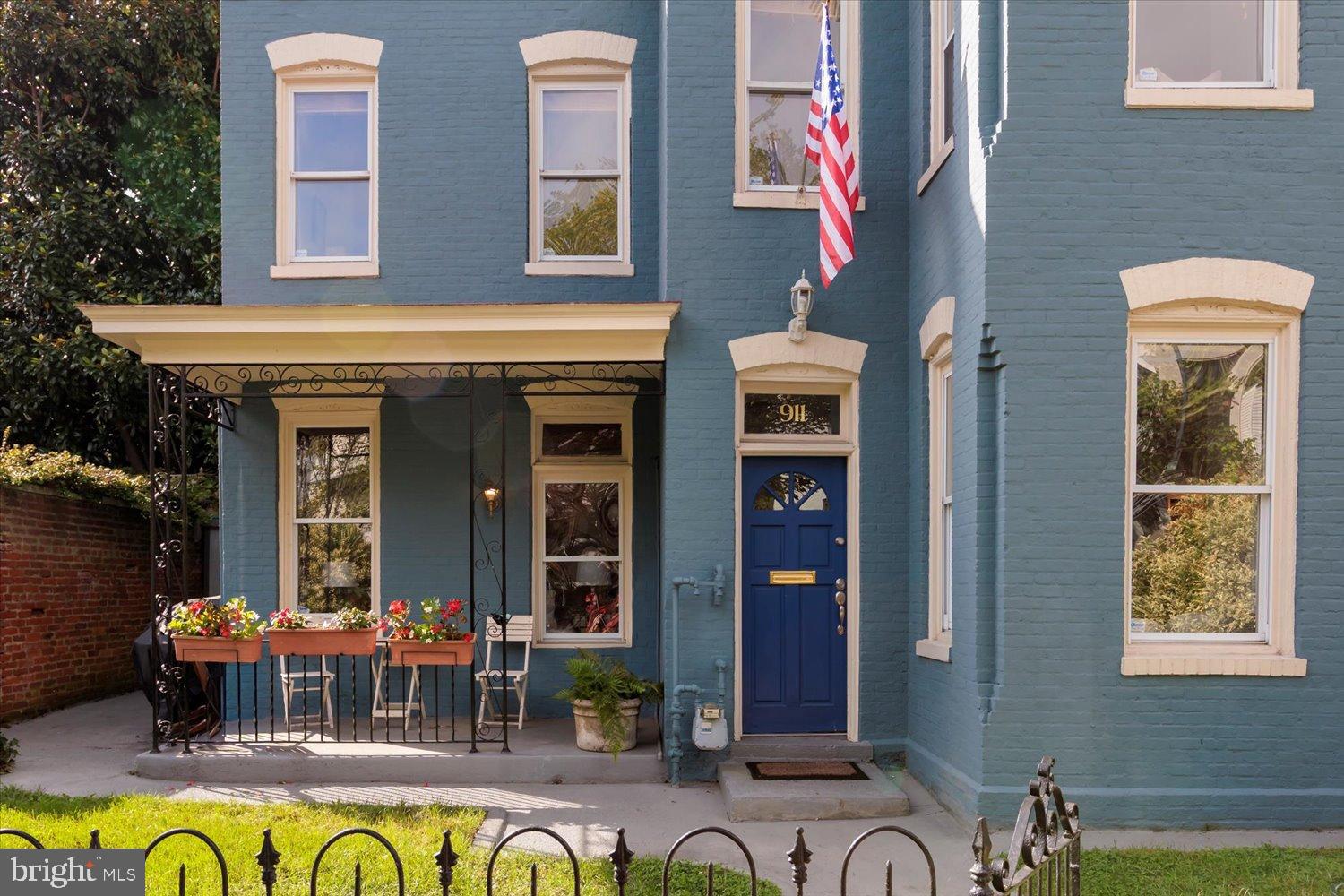 911 Independence Avenue Southeast Washington, DC 20003 - Photo 3 of 38 Charming blue facade with inviting porch.
