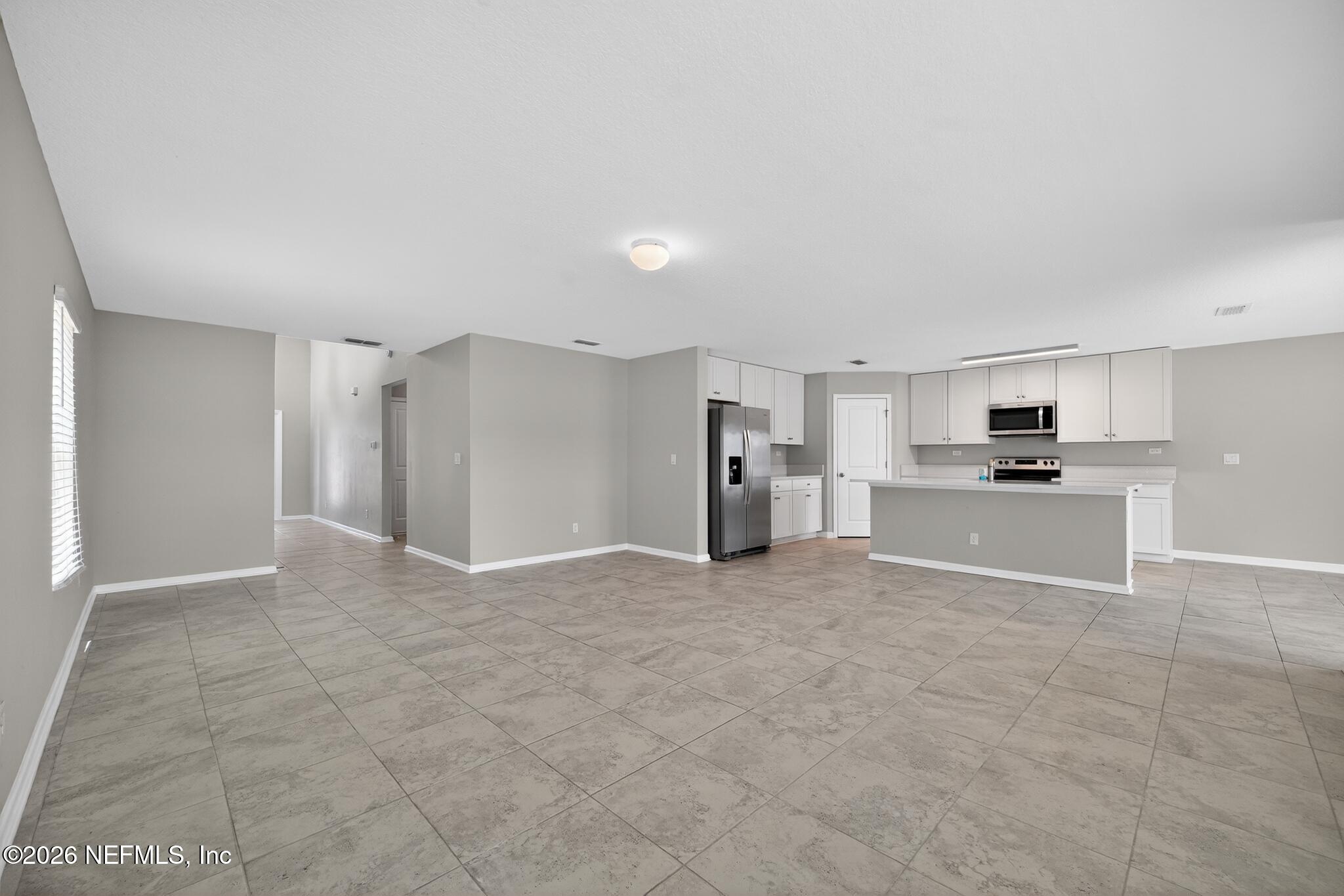 4818 Morning Rise Circle Jacksonville, FL 32218 - Photo 4 of 33 06_4818_Morning_Rise_Cir-Living_room-846