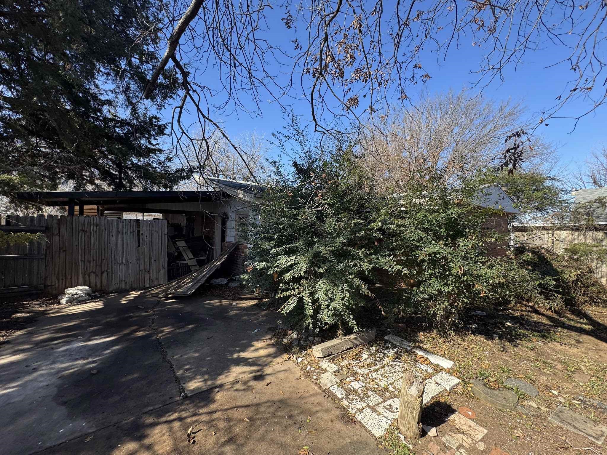 a backyard of a house with a tree